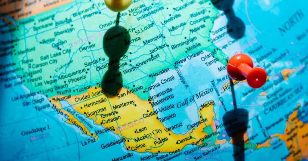 Detailed map of North America featuring pushpins highlighting regions in Mexico and the US.
