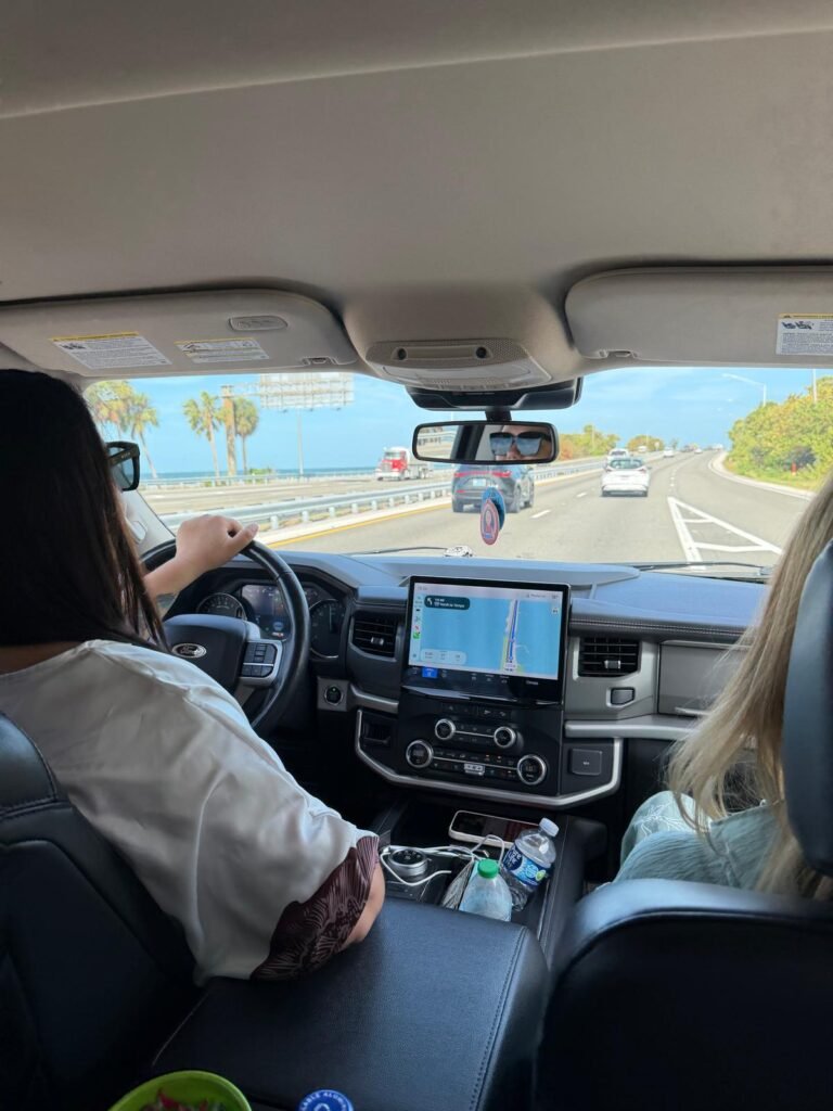Cartier Limousine Services chauffeur driving luxury SUV along Suncoast Florida highway