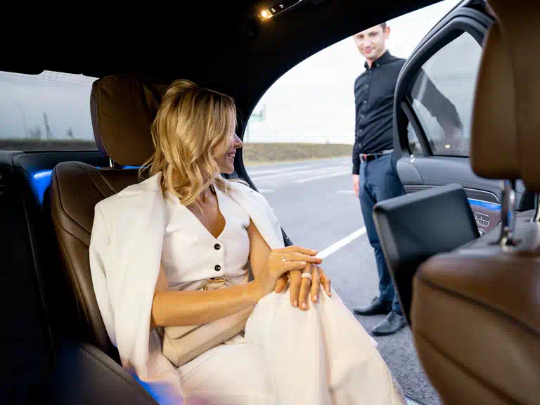 Executive black car service and professional chauffeur waiting for corporate clients in Bradenton Florida